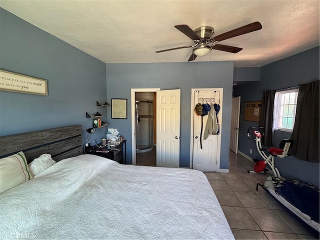 825 E Eagle St, Long Beach, CA 90806 - tiled bedroom with a ceiling fan and ensuite bath