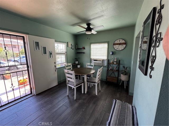 825 E Eagle St, Long Beach, CA 90806 - dining area featuring dark wood-style floors, a ceiling fan, cooling unit, and a textured ceiling