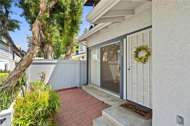 1495 Mccabe Way, West Covina, CA 91791 - doorway to property with stucco siding and a patio