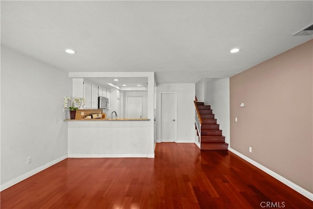 1495 Mccabe Way, West Covina, CA 91791 - unfurnished living room featuring wood finished floors, recessed lighting, and stairs