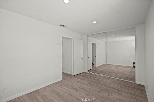 1495 Mccabe Way, West Covina, CA 91791 - unfurnished bedroom with wood finished floors, recessed lighting, and a closet