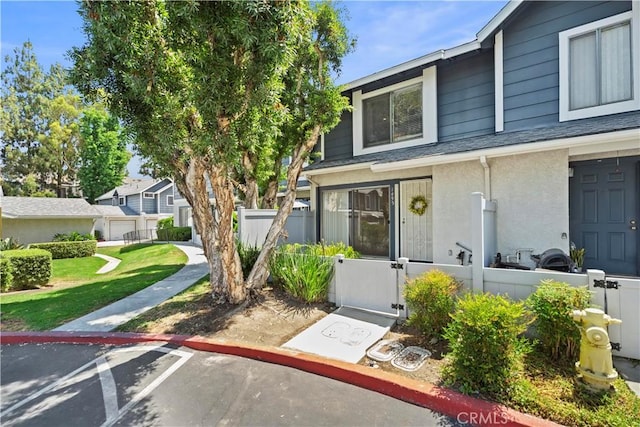 1495 Mccabe Way, West Covina, CA 91791 - view of front facade with stucco siding and a shingled roof