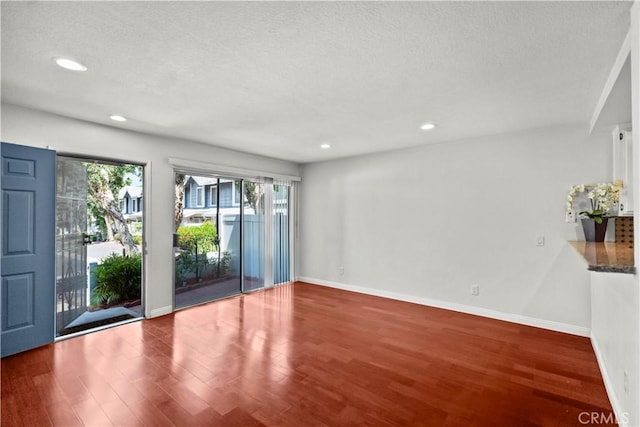 1495 Mccabe Way, West Covina, CA 91791 - unfurnished room featuring a textured ceiling, wood finished floors, and recessed lighting