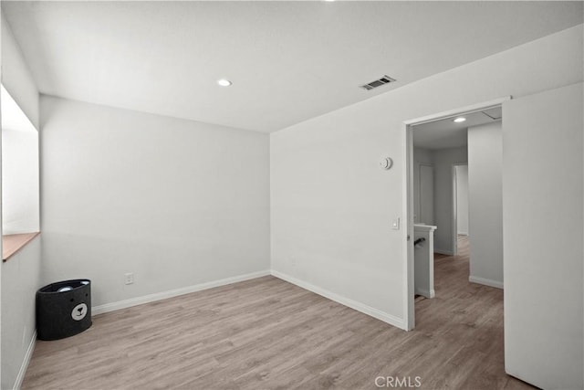 1495 Mccabe Way, West Covina, CA 91791 - spare room featuring wood finished floors and recessed lighting