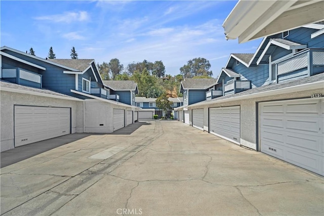 1495 Mccabe Way, West Covina, CA 91791 - view of concrete road with community garages and a residential view