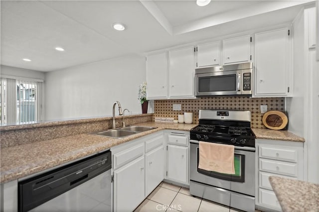 1495 Mccabe Way, West Covina, CA 91791 - kitchen featuring stainless steel appliances, white cabinetry, light countertops, light tile patterned floors, and recessed lighting