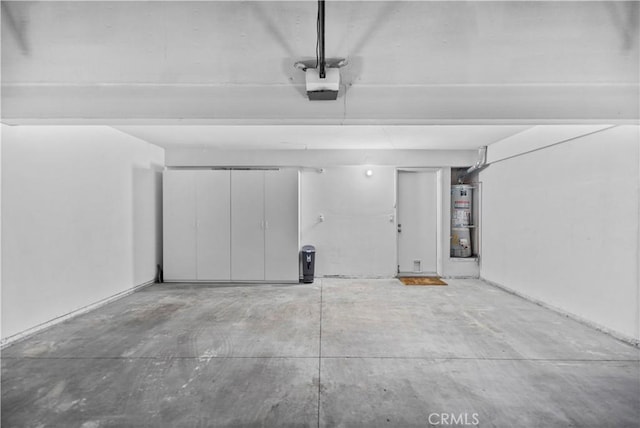 1495 Mccabe Way, West Covina, CA 91791 - garage featuring water heater and a garage door opener