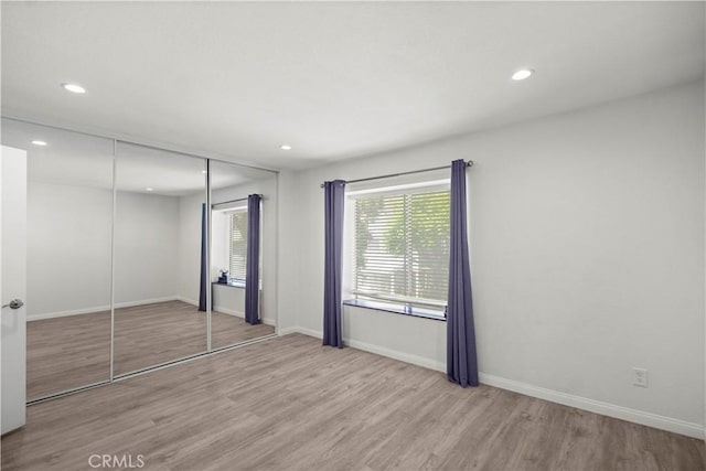 1495 Mccabe Way, West Covina, CA 91791 - unfurnished bedroom featuring wood finished floors, recessed lighting, and a closet