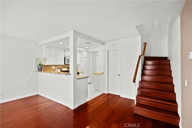 1495 Mccabe Way, West Covina, CA 91791 - stairs with wood finished floors and recessed lighting