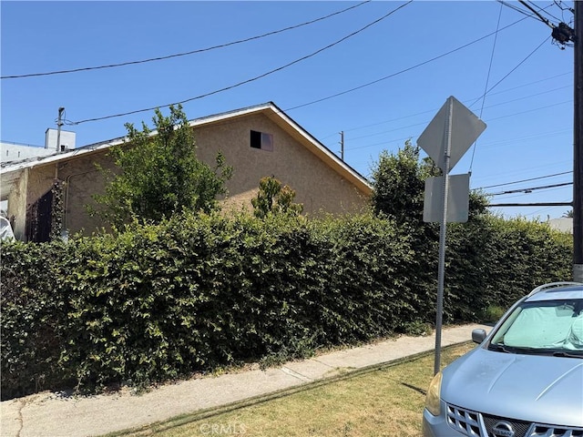 1569 E 109th St, Los Angeles, CA 90059 - view of home's exterior featuring stucco siding