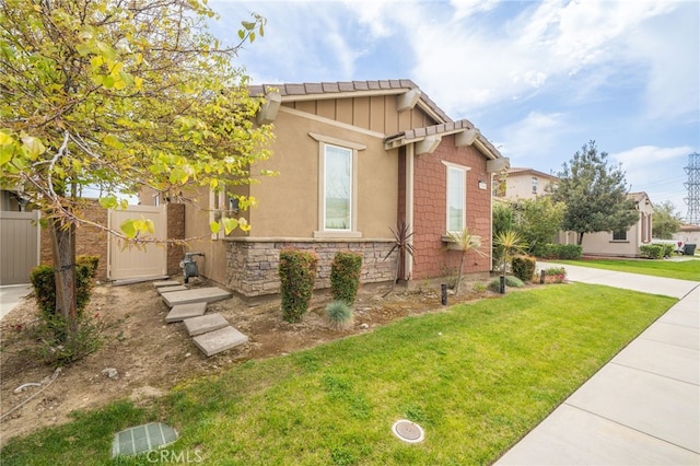 13243 Stanton Dr, Rancho Cucamonga, CA 91739 - view of front of property featuring stone siding and board and batten siding