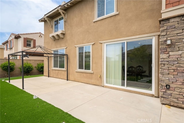 13243 Stanton Dr, Rancho Cucamonga, CA 91739 - back of property with a gazebo, stucco siding, a patio area, and stone siding