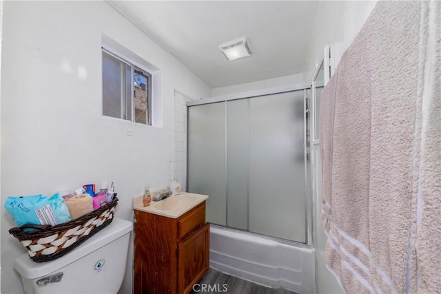 1684 E Martin Luther King Jr Blvd, Los Angeles, CA 90011 - bathroom featuring vanity, shower / bath combination with glass door, and wood finished floors
