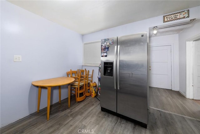 1684 E Martin Luther King Jr Blvd, Los Angeles, CA 90011 - kitchen featuring stainless steel refrigerator with ice dispenser and wood finished floors