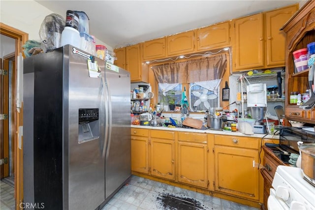 1684 E Martin Luther King Jr Blvd, Los Angeles, CA 90011 - kitchen featuring stainless steel fridge with ice dispenser, light countertops, light floors, and stove