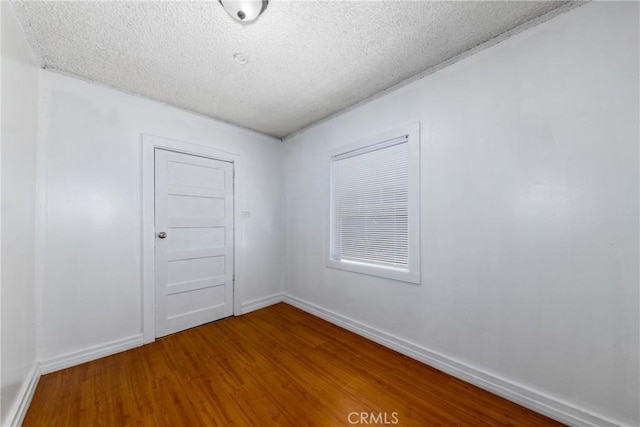 1684 E Martin Luther King Jr Blvd, Los Angeles, CA 90011 - empty room featuring a textured ceiling and wood finished floors