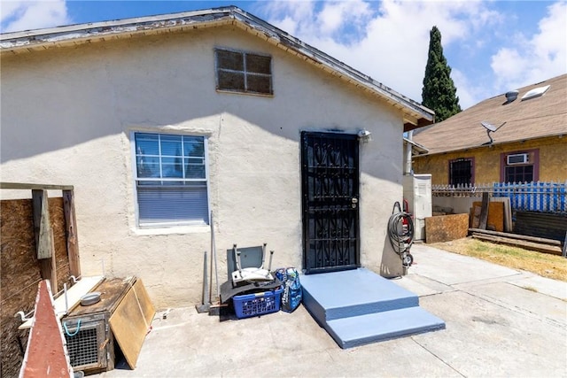 1684 E Martin Luther King Jr Blvd, Los Angeles, CA 90011 - rear view of property with stucco siding and a patio