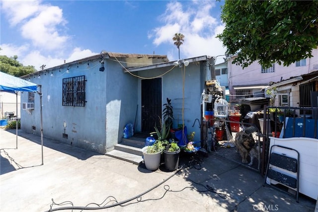 1684 E Martin Luther King Jr Blvd, Los Angeles, CA 90011 - rear view of house featuring stucco siding and a patio