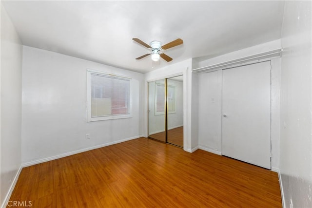 1684 E Martin Luther King Jr Blvd, Los Angeles, CA 90011 - unfurnished bedroom with two closets, wood finished floors, and ceiling fan