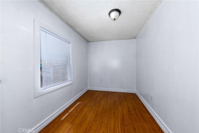 1684 E Martin Luther King Jr Blvd, Los Angeles, CA 90011 - spare room with wood finished floors and a textured ceiling