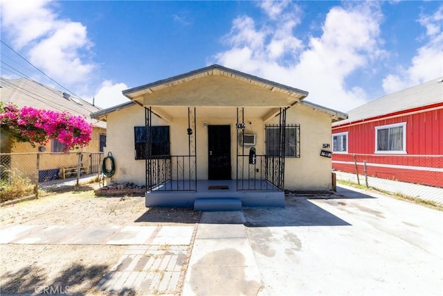 1684 E Martin Luther King Jr Blvd, Los Angeles, CA 90011 - bungalow-style home featuring stucco siding and a porch