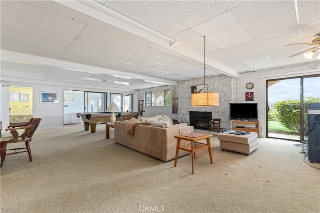 750 Luisita St, Morro Bay, CA 93442 - living area with a paneled ceiling, light colored carpet, a fireplace, pool table, and ceiling fan