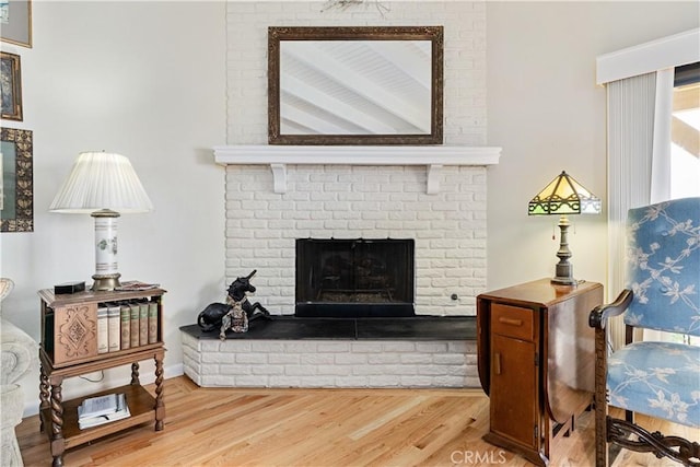 750 Luisita St, Morro Bay, CA 93442 - living area featuring wood finished floors and a brick fireplace
