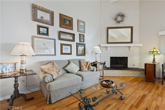 750 Luisita St, Morro Bay, CA 93442 - living area with wood finished floors and a brick fireplace