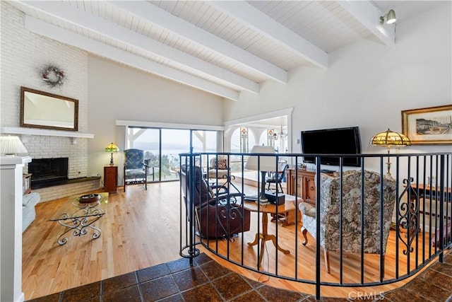 750 Luisita St, Morro Bay, CA 93442 - stairway featuring beam ceiling, a fireplace, and high vaulted ceiling