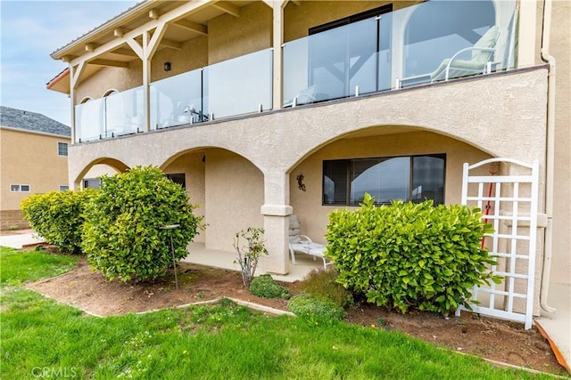 750 Luisita St, Morro Bay, CA 93442 - rear view of property with stucco siding and a balcony