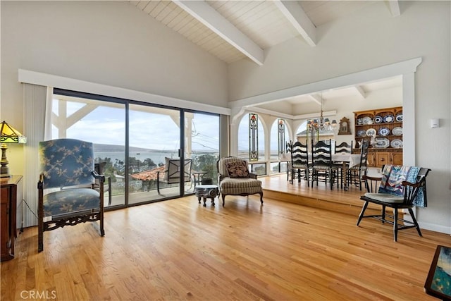 750 Luisita St, Morro Bay, CA 93442 - living area with beamed ceiling, plenty of natural light, high vaulted ceiling, light wood-type flooring, and a chandelier
