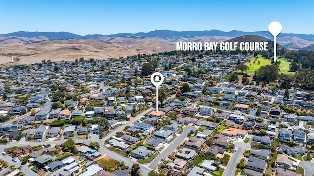 750 Luisita St, Morro Bay, CA 93442 - aerial overview of property's location with a mountain backdrop and nearby suburban area