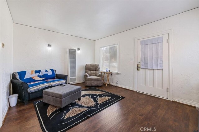 228 S 4th St, Santa Paula, CA 93060 - living area featuring a heating unit and wood finished floors