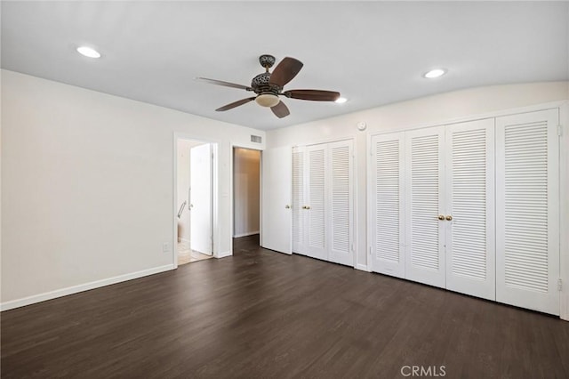 1296 Tiger Tail Dr, Riverside, CA 92506 - unfurnished bedroom featuring multiple closets, dark wood-style flooring, recessed lighting, and a ceiling fan
