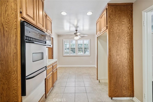 1296 Tiger Tail Dr, Riverside, CA 92506 - kitchen with a warming drawer, appliances with stainless steel finishes, a ceiling fan, light countertops, and recessed lighting
