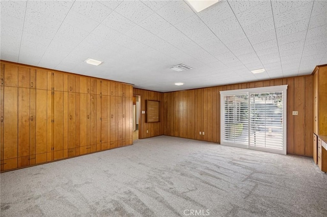 1296 Tiger Tail Dr, Riverside, CA 92506 - spare room with light colored carpet and wooden walls