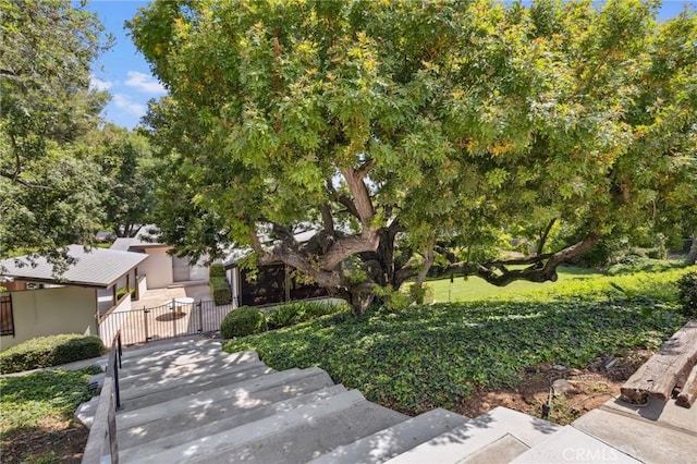 1296 Tiger Tail Dr, Riverside, CA 92506 - view of property hidden behind natural elements featuring a gate and a fenced front yard