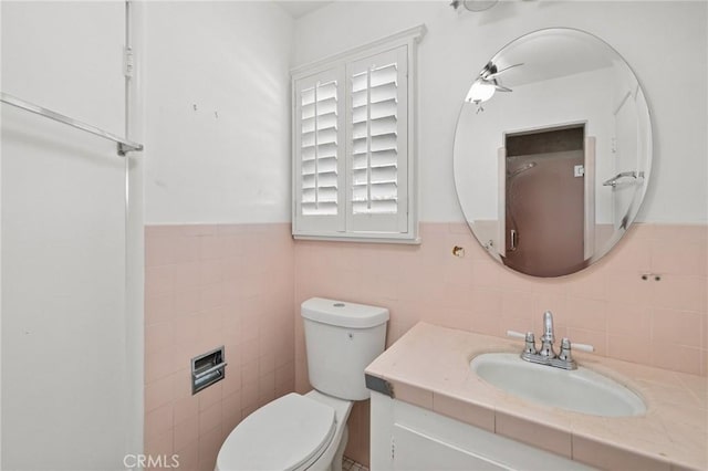 1296 Tiger Tail Dr, Riverside, CA 92506 - bathroom with vanity, tile walls, and a wainscoted wall