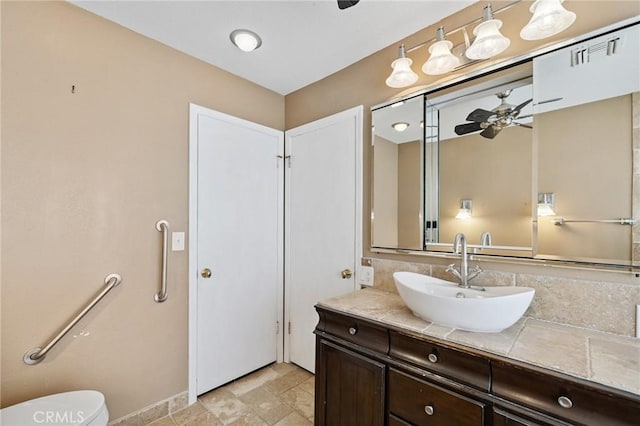 1296 Tiger Tail Dr, Riverside, CA 92506 - bathroom with a ceiling fan, vanity, and stone finish floors