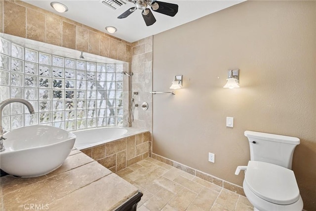 1296 Tiger Tail Dr, Riverside, CA 92506 - full bathroom with a ceiling fan, tiled shower / bath, stone finish floors, and vanity