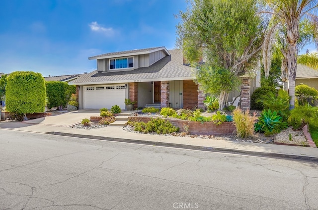 23402 Devonshire Dr, Lake Forest, CA 92630 - view of front of property with driveway, covered porch, and a garage