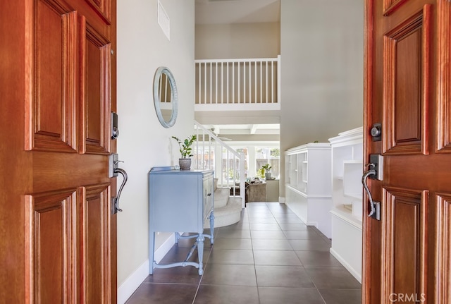 23402 Devonshire Dr, Lake Forest, CA 92630 - foyer featuring dark tile patterned flooring and baseboards