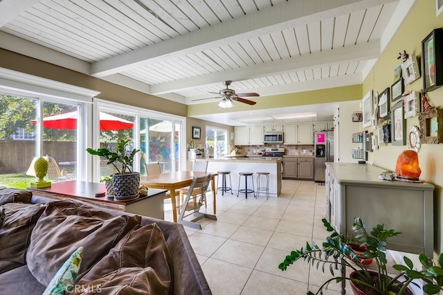 23402 Devonshire Dr, Lake Forest, CA 92630 - living room featuring light tile patterned flooring, beamed ceiling, and ceiling fan