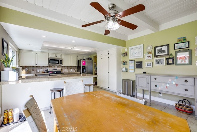 23402 Devonshire Dr, Lake Forest, CA 92630 - dining area with a ceiling fan, light tile patterned floors, and a wood ceiling with exposed beams