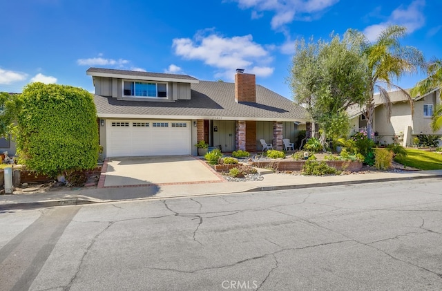 23402 Devonshire Dr, Lake Forest, CA 92630 - view of front of home with a chimney, driveway, an attached garage, and board and batten siding