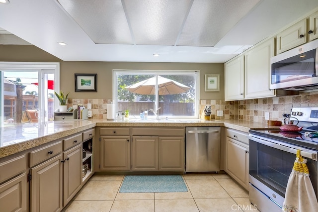 23402 Devonshire Dr, Lake Forest, CA 92630 - kitchen with stainless steel appliances, tile countertops, decorative backsplash, light tile patterned flooring, and recessed lighting