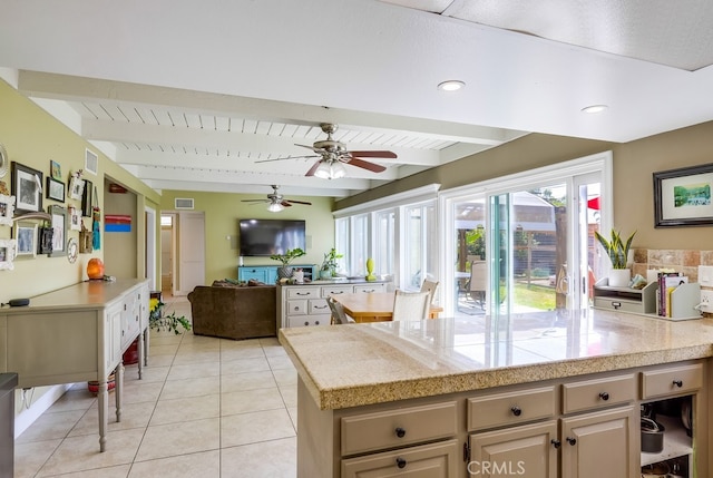 23402 Devonshire Dr, Lake Forest, CA 92630 - kitchen with beam ceiling, light tile patterned flooring, ceiling fan, open floor plan, and tile counters