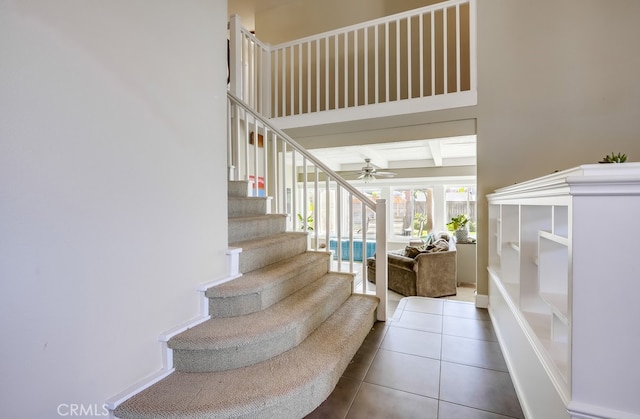 23402 Devonshire Dr, Lake Forest, CA 92630 - stairs featuring ceiling fan, tile patterned floors, and beam ceiling