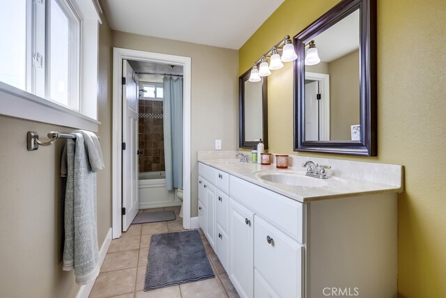 23402 Devonshire Dr, Lake Forest, CA 92630 - bathroom featuring double vanity, tile patterned floors, and shower / tub combo with curtain