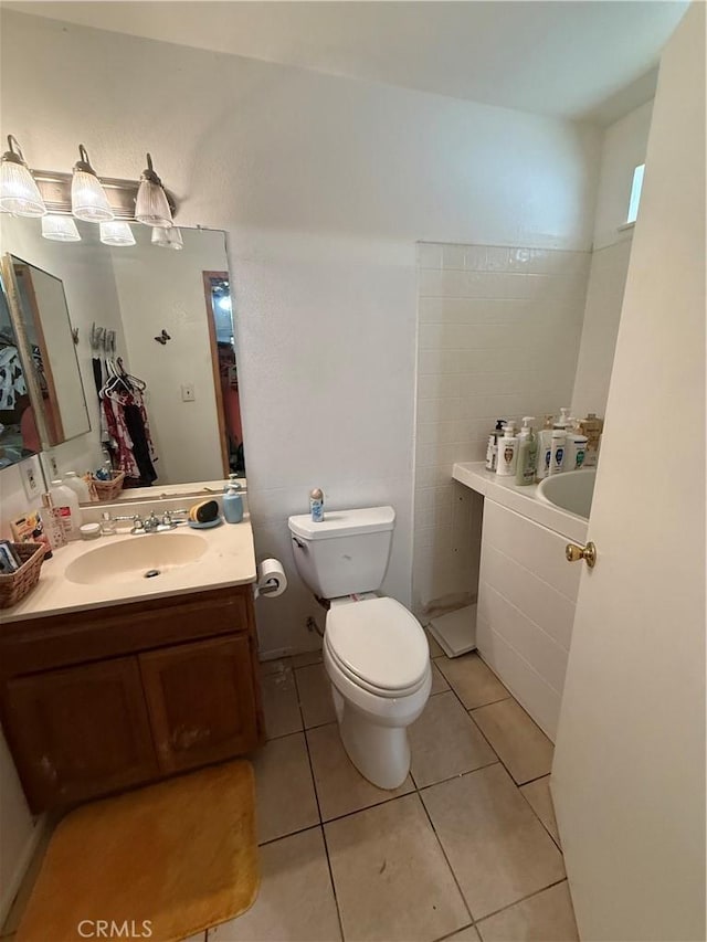 5320 Jonah St, Bakersfield, CA 93307 - full bathroom with tile patterned flooring, a bath, and vanity